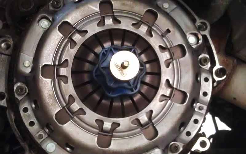 newly fitted clutch close up photographed from underneath with the cars gearbox still off