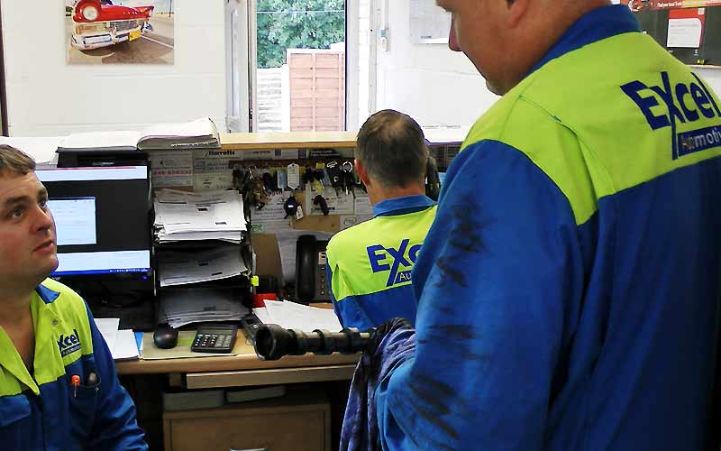 excel mechanics gathered in the reception area