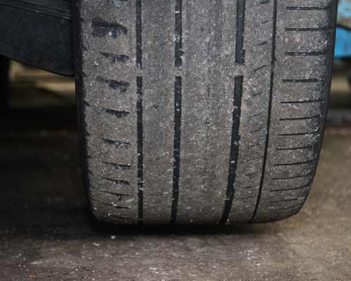 uk tyre law measure indicating tyre tread legal limit