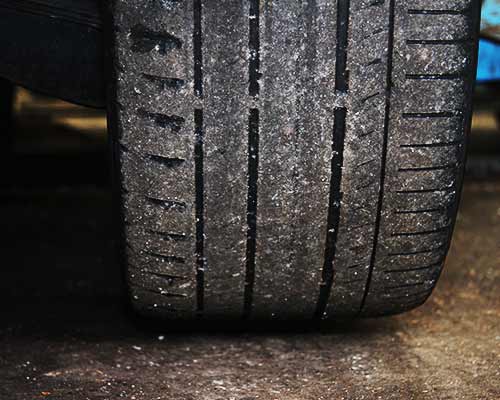 uk tyre law measure indicating tyre tread legal limit